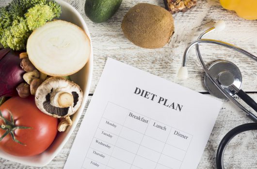 diet-plan-with-vegetables-stethoscope-wooden-desk